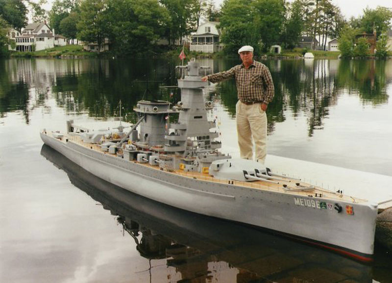 Man and his model of battleship